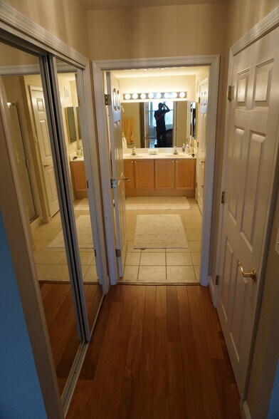 Master bath hallway, walkin closet on right and extra closet on left - 11776 Stratford House Pl