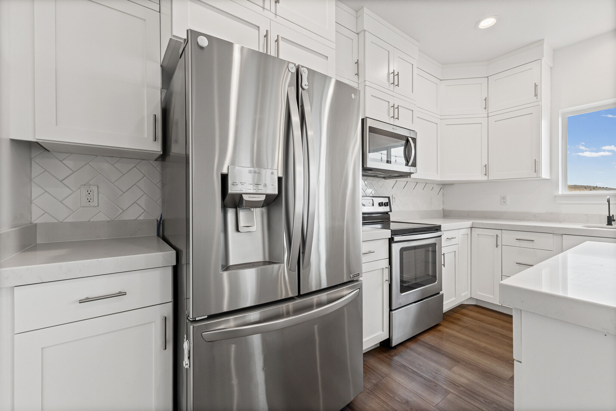 Fridge, microwave, dishwasher and range - 4877 E Silver Ridge Rd