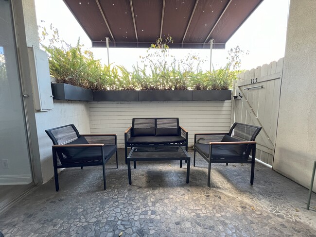 Private Patio next to pool and pool house. - 7250 Franklin Ave