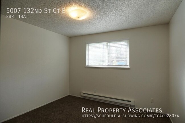 Building Photo - Spacious Two Bedroom Duplex Home with an A...