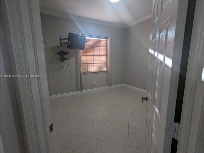 Building Photo - Northwest 91st Court, Hialeah Gardens, FL 33018 - 3 BR 1 BA single-family home