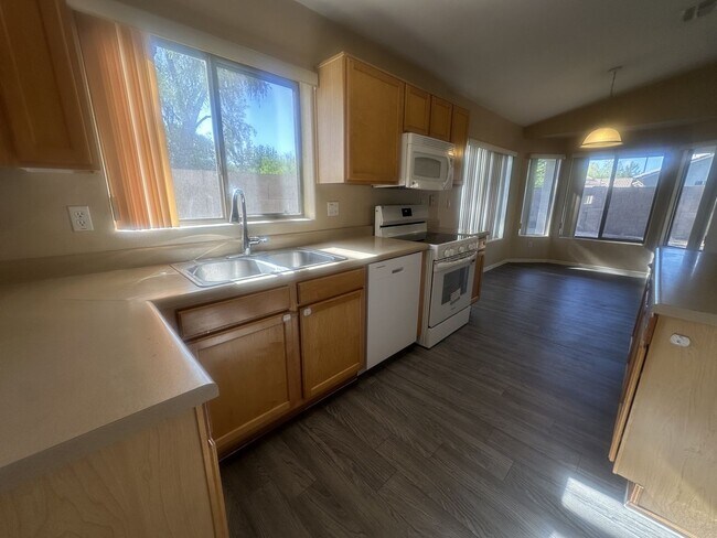 Building Photo - Rare single-level home offers 5 bedrooms and a versatile floor plan designed for comfortable living