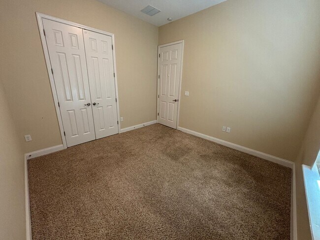 Building Photo - Spacious 4BR/3BA Home with 3-Car Garage, Bonus Office & Covered Patio in St Johns!