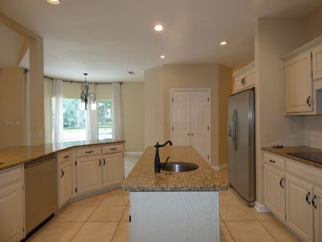 Building Photo - Spacious 4-Bedroom Pool Home