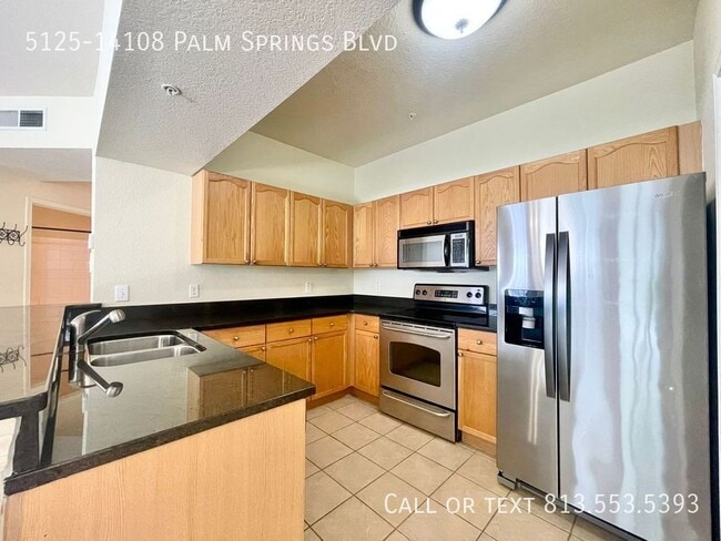 Building Photo - 5125-14108 Palm Springs Blvd-