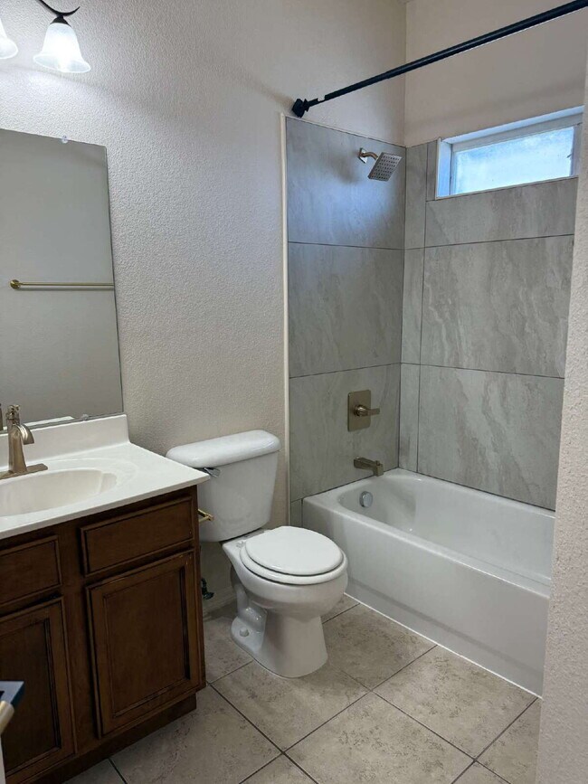 Building Photo - "Spacious 4-Bedroom Oasis with Granite Kit...