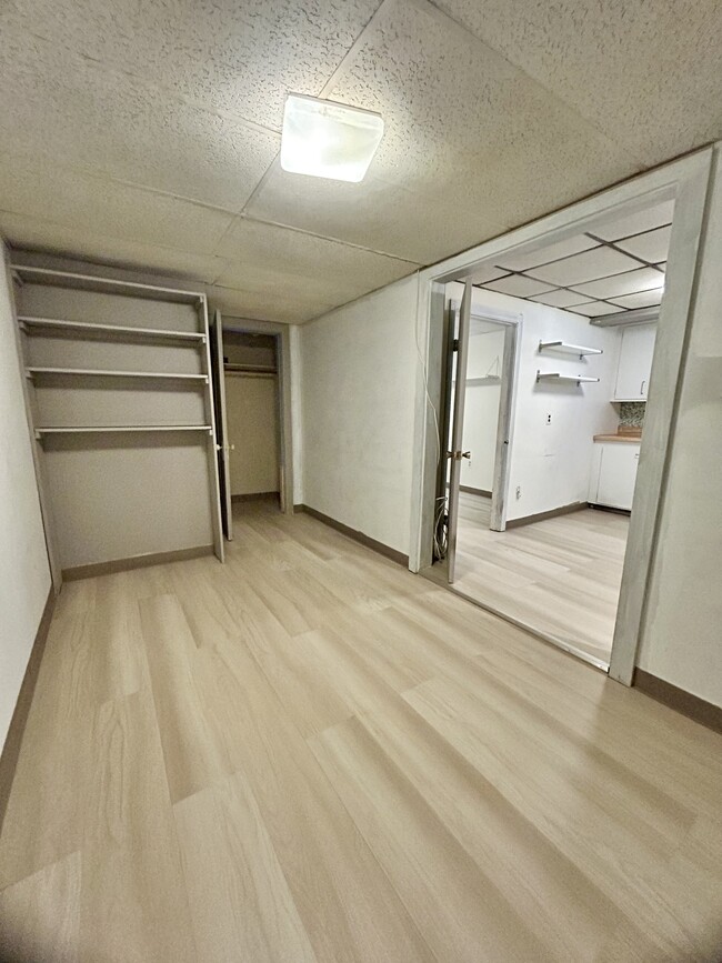 Living room with coat closet - 397 Boylston St