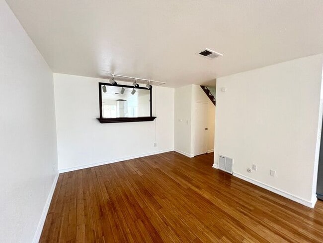 Building Photo - Stunning 4BR Townhome with Hardwood Floors, Private Patio, Community Pool & 2-Car Garage!