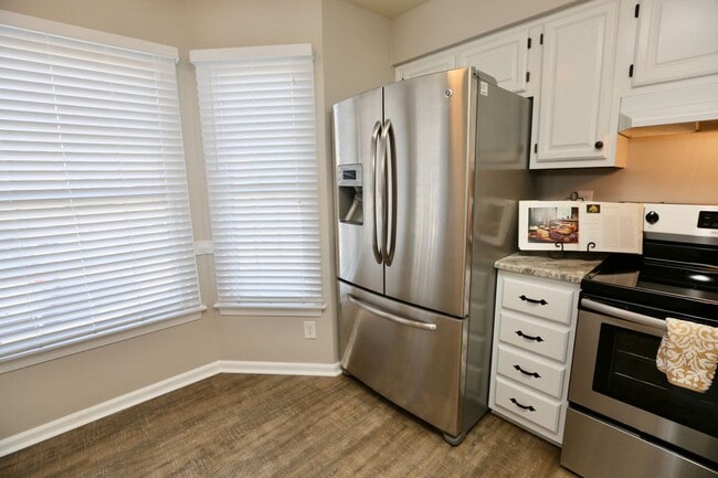 Building Photo - Updated End-Unit Brick Townhome Ready NOW!...