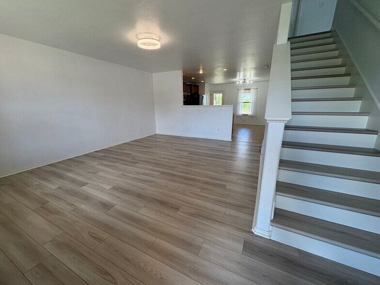 Front door opens to downstairs living room - 4208 SW Fieldstone Blvd
