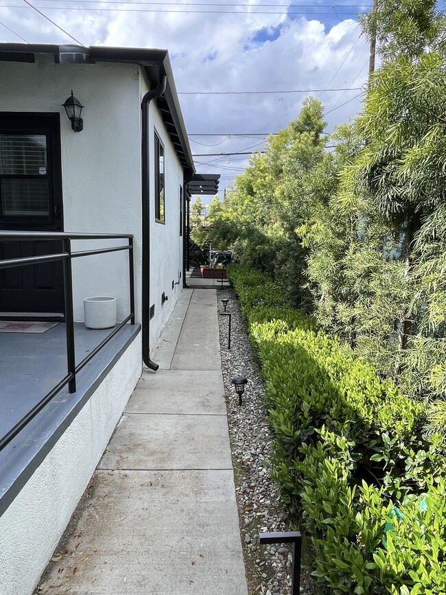 Back of Triplex toward large back patio area and garage - 3211 W Alameda Ave