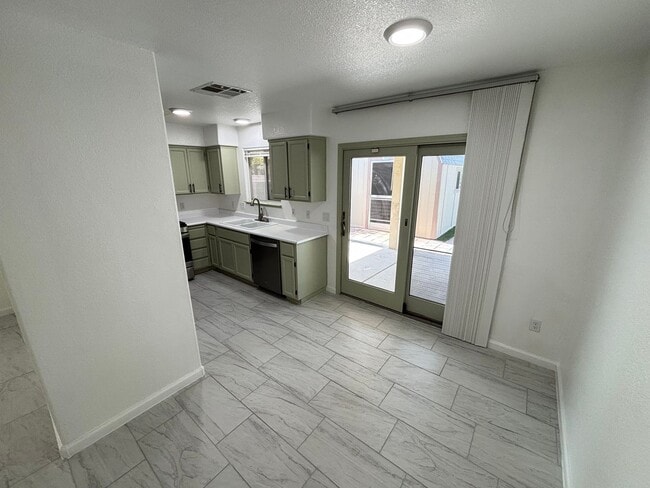 Building Photo - This inviting single-story home boasts a s...