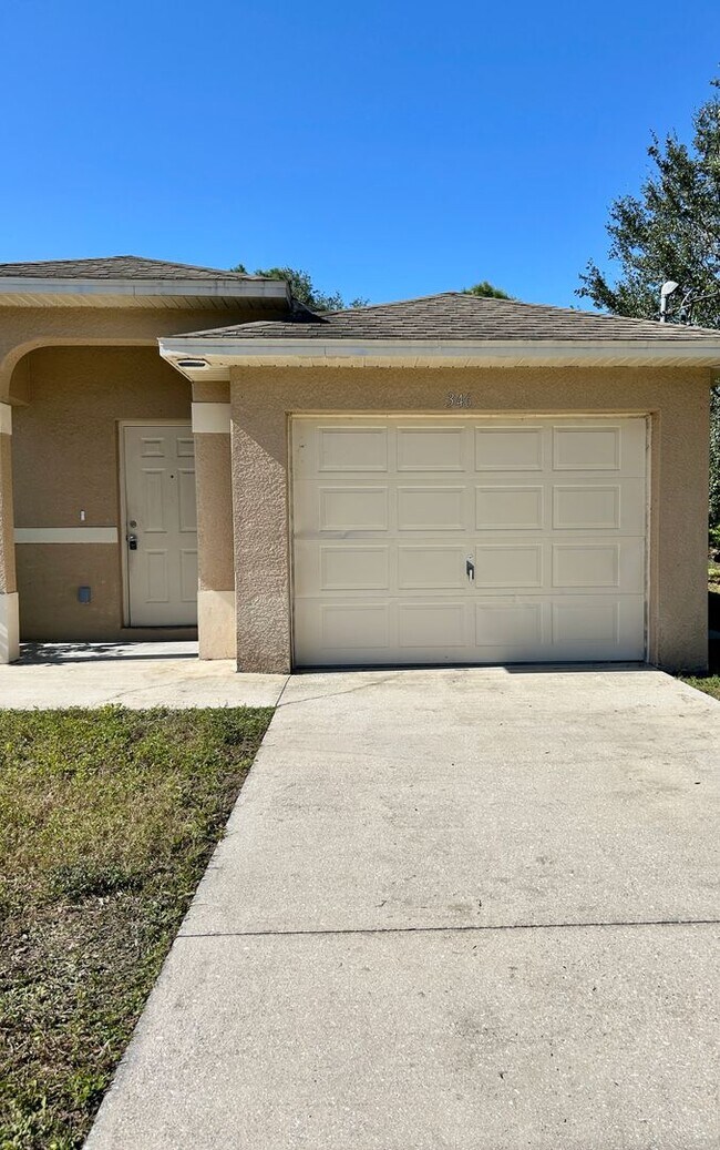 Building Photo - Charming 3BR/2BA Lehigh Acres Duplex with 1-Car Garage | Lawn Care & Salt Service Included