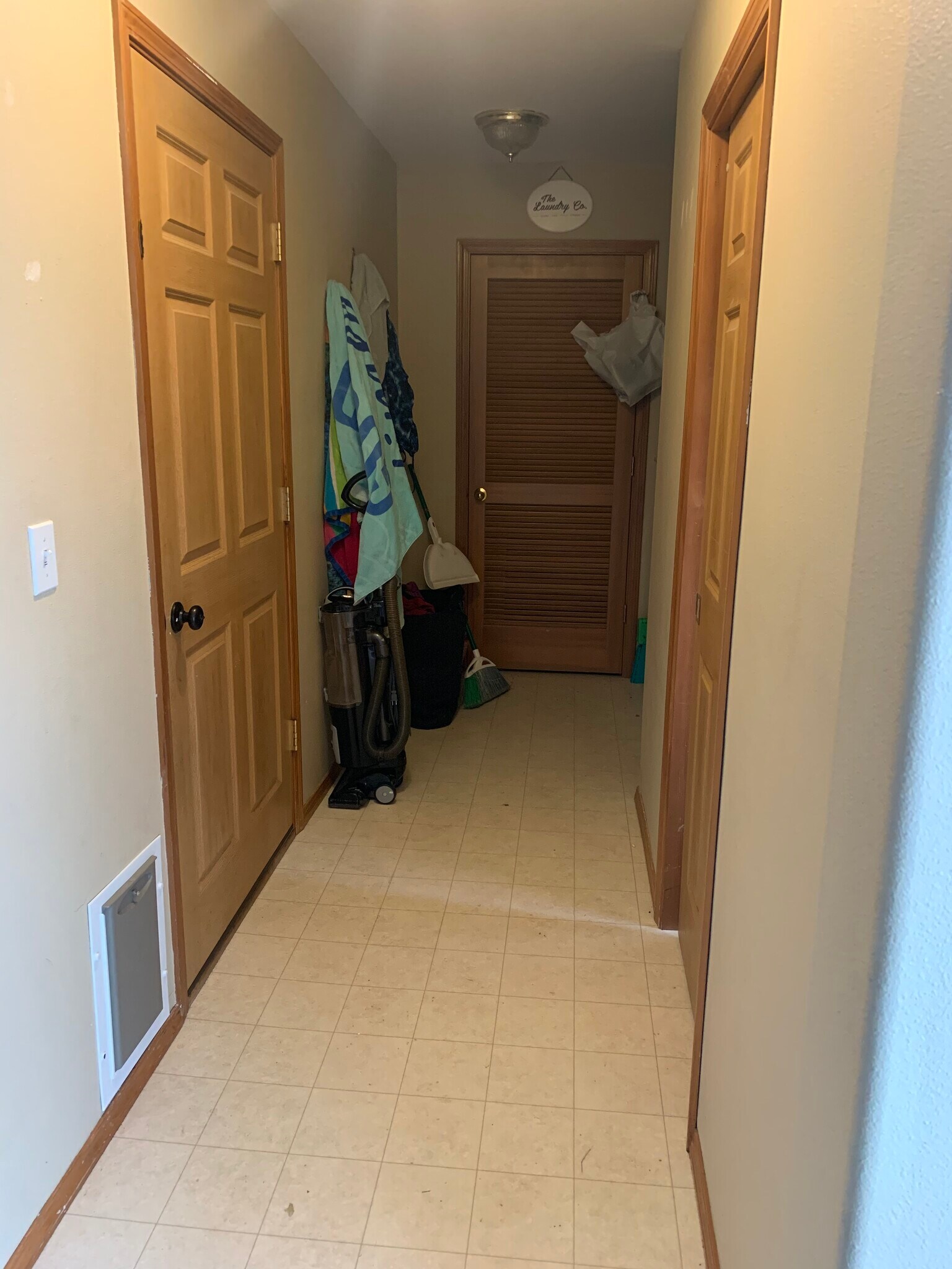 Laundry Rook and Door to Garage and half bath - 206 E Illinois St