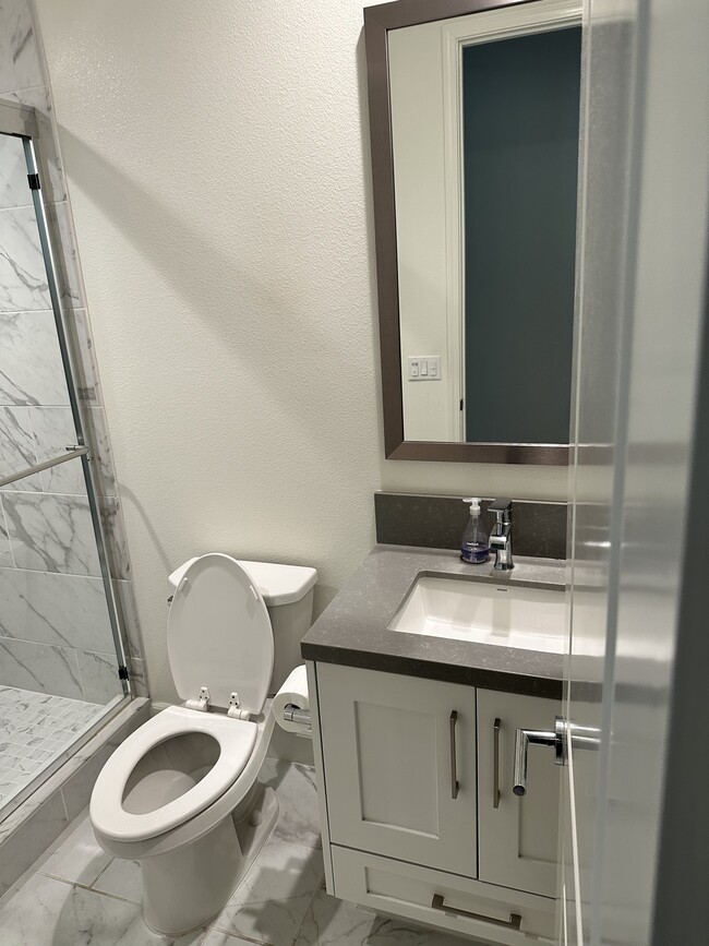The 1st full bath downstairs - 1272 E Providence Loop