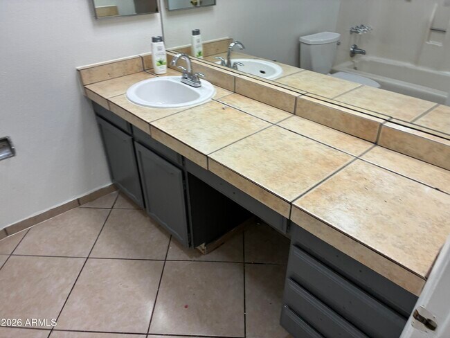 Building Photo - 8819 W Roma Ave