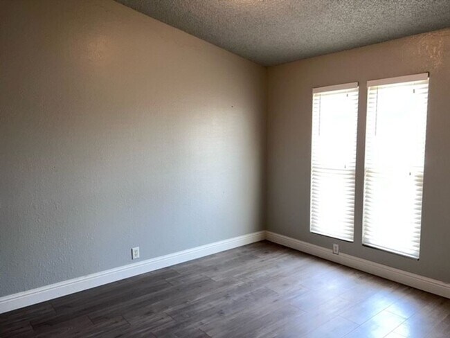 Building Photo - Laminate flooring throughout. Solar panels...