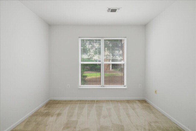Building Photo - Commuter’s Paradise! Ground-Level 2BR Condo  Welcome home to this stunning, sun-filled 2-bedroom ...