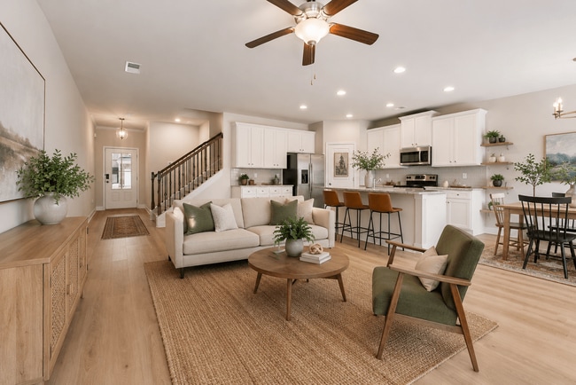 Spacious living room filled with abundant natural light. - Parkwood Terrace
