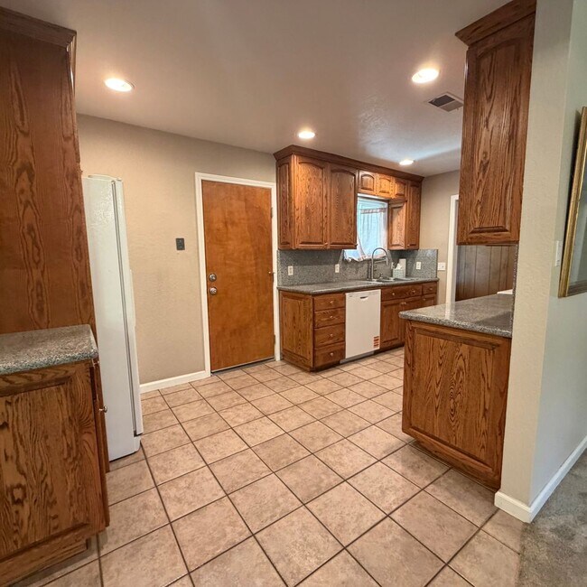 Building Photo - Adorable house with large deck,  yard and RV access
