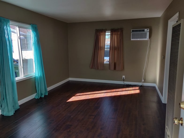 living room with new ac with remote - 6414 10th Ave