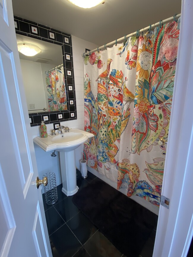 Full bathroom with bathtub and shower and marble floor - 62 Alba Rd