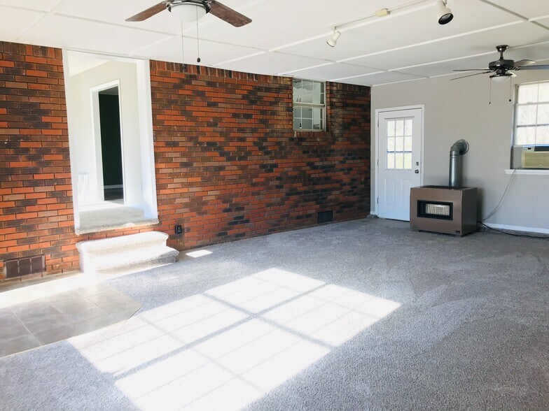 Den looking toward kitchen - 9225 Amos Rd