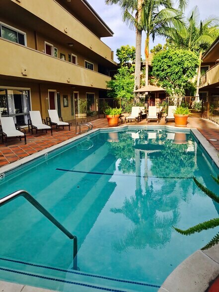 Lounge in the heated pool year round, steps from your door - 970 Palm Avenue