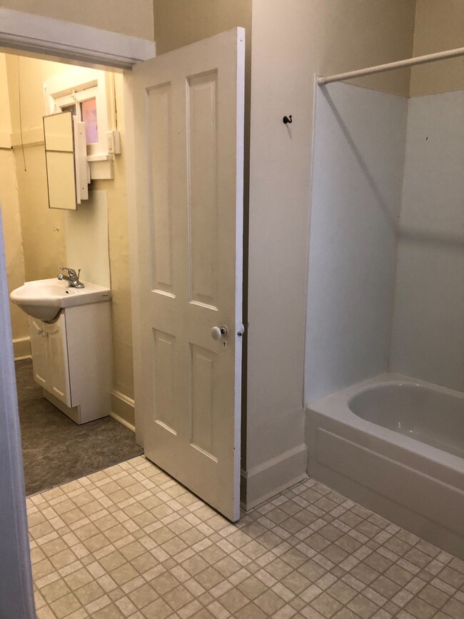 Bathroom looking into toilet room - 310 E 4th St