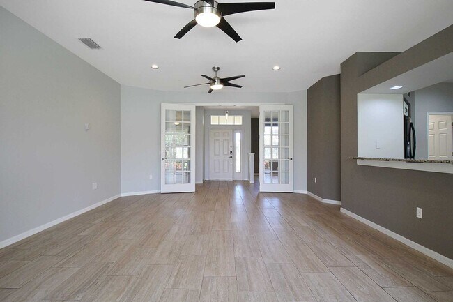 Building Photo - Annual rental: Spacious 3BR/2BA Creekwood Home with Office, Screened Lanai, EV Charger & Resort-S...