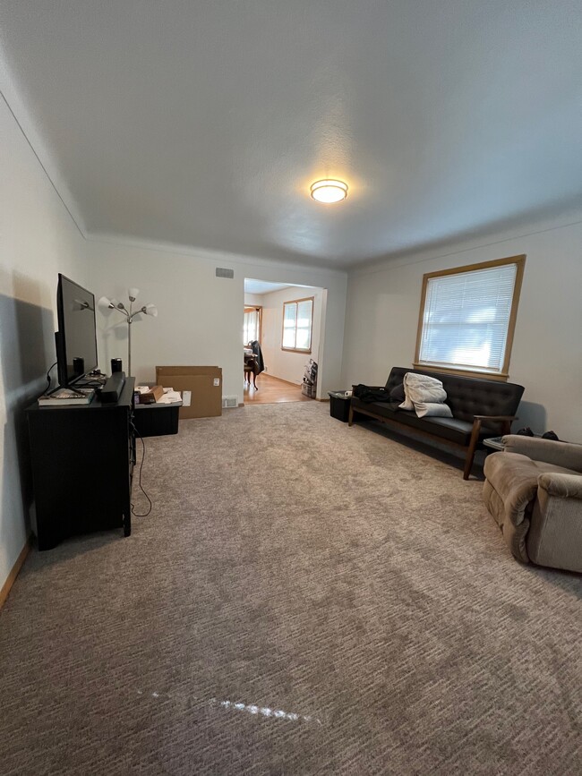 Living room with new carpet in 2022. - 1060 21st Ave SE