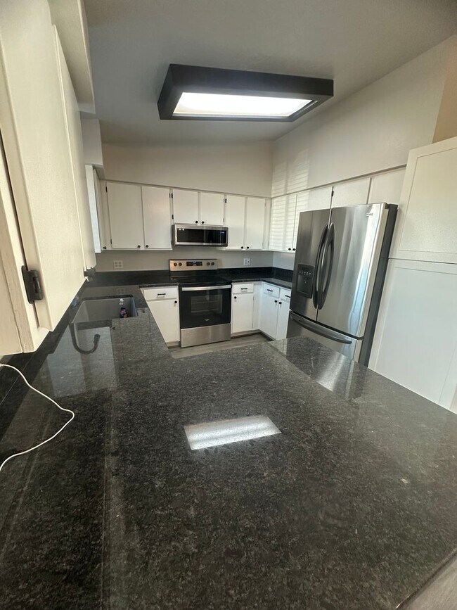 Building Photo - Quiet neighborhood, 3 bedroom, 2 bath home, huge front patio/deck, RV parking!