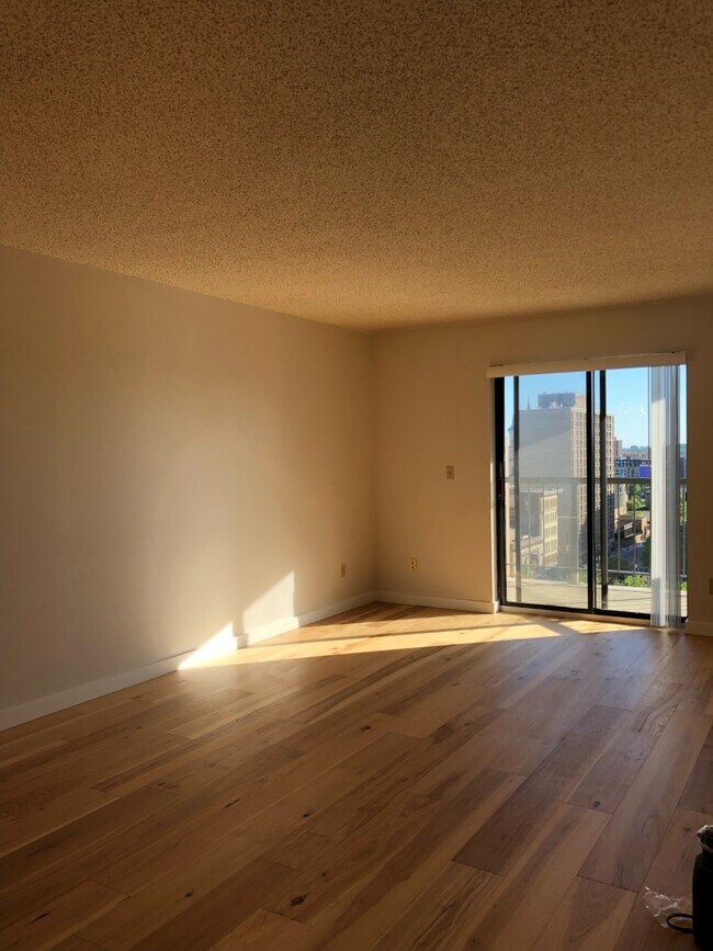 Living Room with New Flooring - 78 10th St E