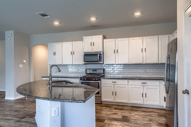 Building Photo - Welcome to this beautifully maintained 4-bedroom, 2-bathroom home in the highly desirable Whisper...
