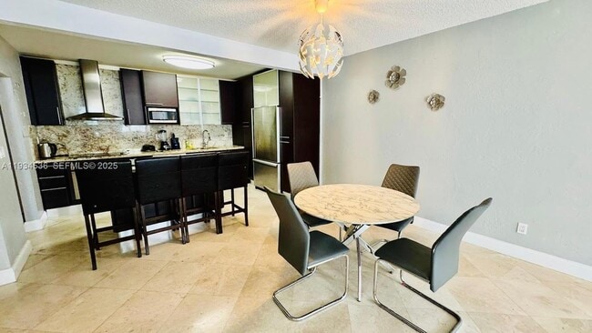 Building Photo - 19390 Collins Ave