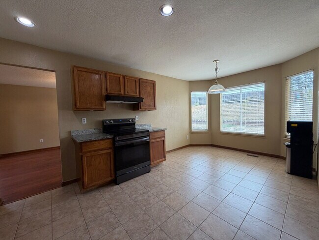 Building Photo - ~Available Now~  Beautiful Four Bedroom Home with Fireplace, Private Yard & Luxurious Primary Suite!