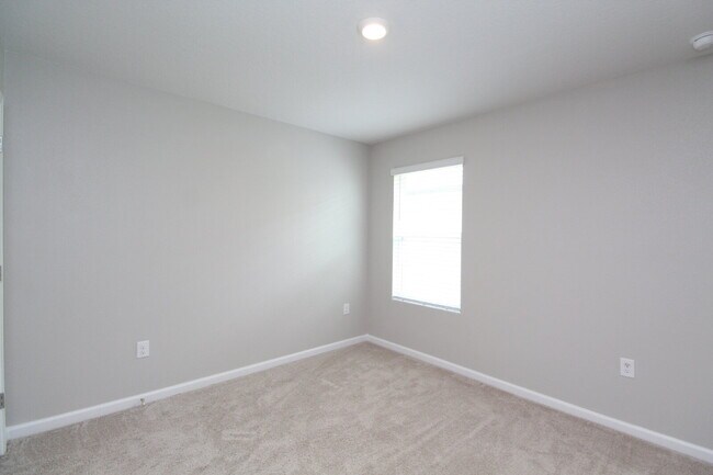 Building Photo - Coming Available Soon – 4BR/2BA Brick Home with Open Floor Plan, Solar Panels & 2-Car Garage in L...