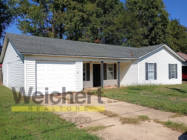Primary Photo - Spacious 3-Bedroom Home with Garage and Sc...