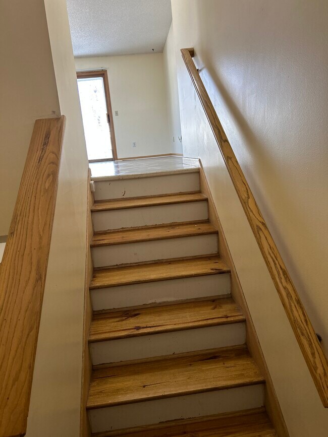Stairs to upper level - 4115 119th Ave NW