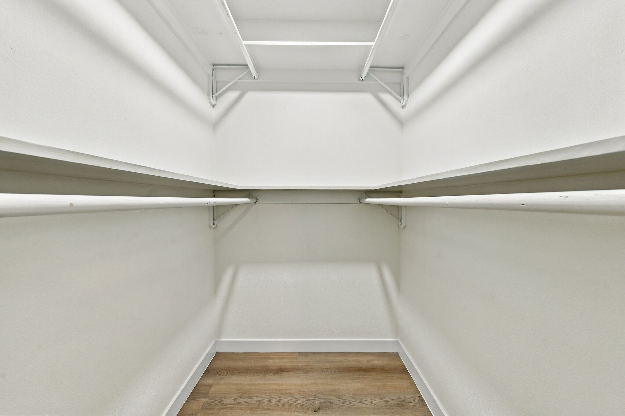 Primary bed closet - 8339 Carvel Ln