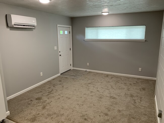 living room and front door - 705 Peach Tree Ln