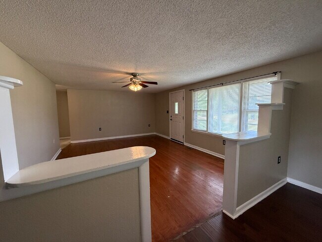 Building Photo - Will consider Section 8 "Charming 4-Bedroom Home with Hardwood Floors on Ready Section Road!"