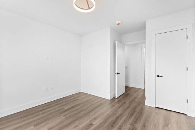 Building Photo - 2 Bedroom Corner-Unit with Wooded Balcony ...