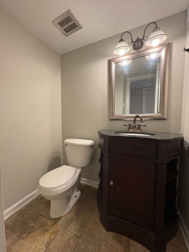 Building Photo - Four Bedroom Townhome Available Now