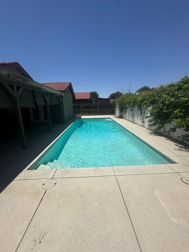 Building Photo - Spacious 4-Bedroom Home with Pool