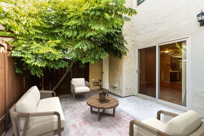 Building Photo - 2 Bedroom 1.5 Bath Townhome with  pvt patio (AC/Pool/Gated Parking/EV Chargers)