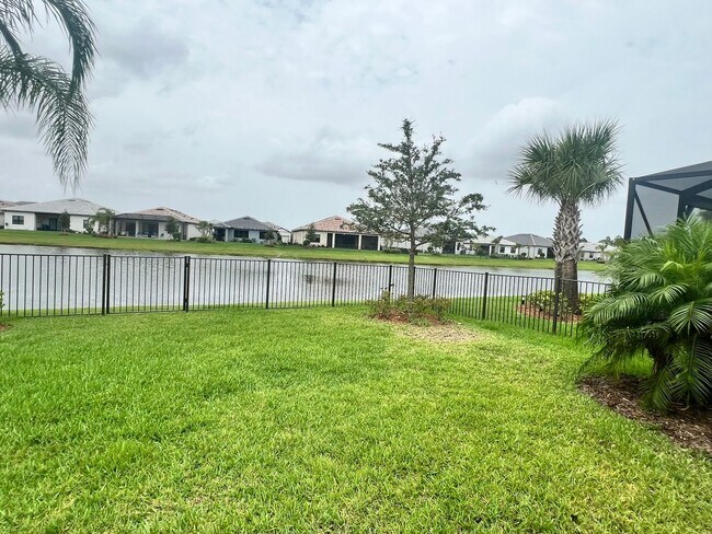 Building Photo - STUNNING LAKEFRONT 3 BEDROOM, 2.5 BATH HOM...