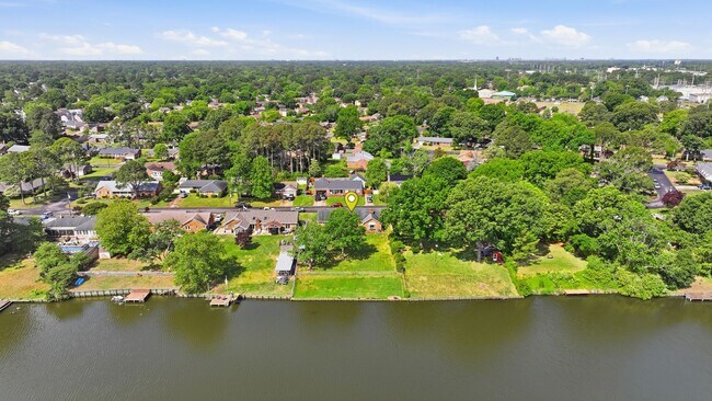 Building Photo - Stunning 4-Bedroom Waterfront Retreat with Modern Upgrades & Lake Living.