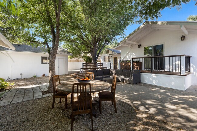 Many areas for entertaining in the back yard amongst the mature trees - 228 N Pueblo Ave