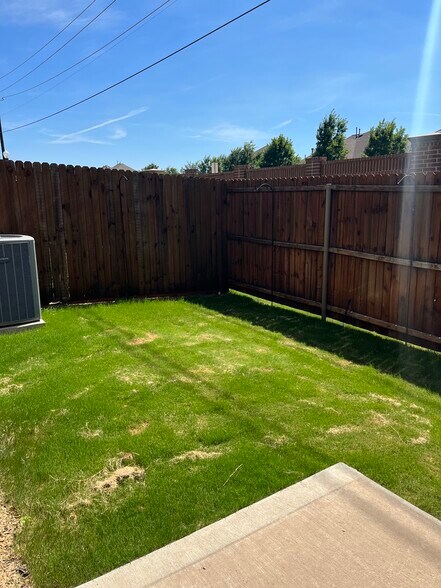 Backyard. There is an outside gas connection for grill connected to house. - 913 Brookville Ct